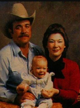 _ A vintage picture of Belinda with her husband and daughter